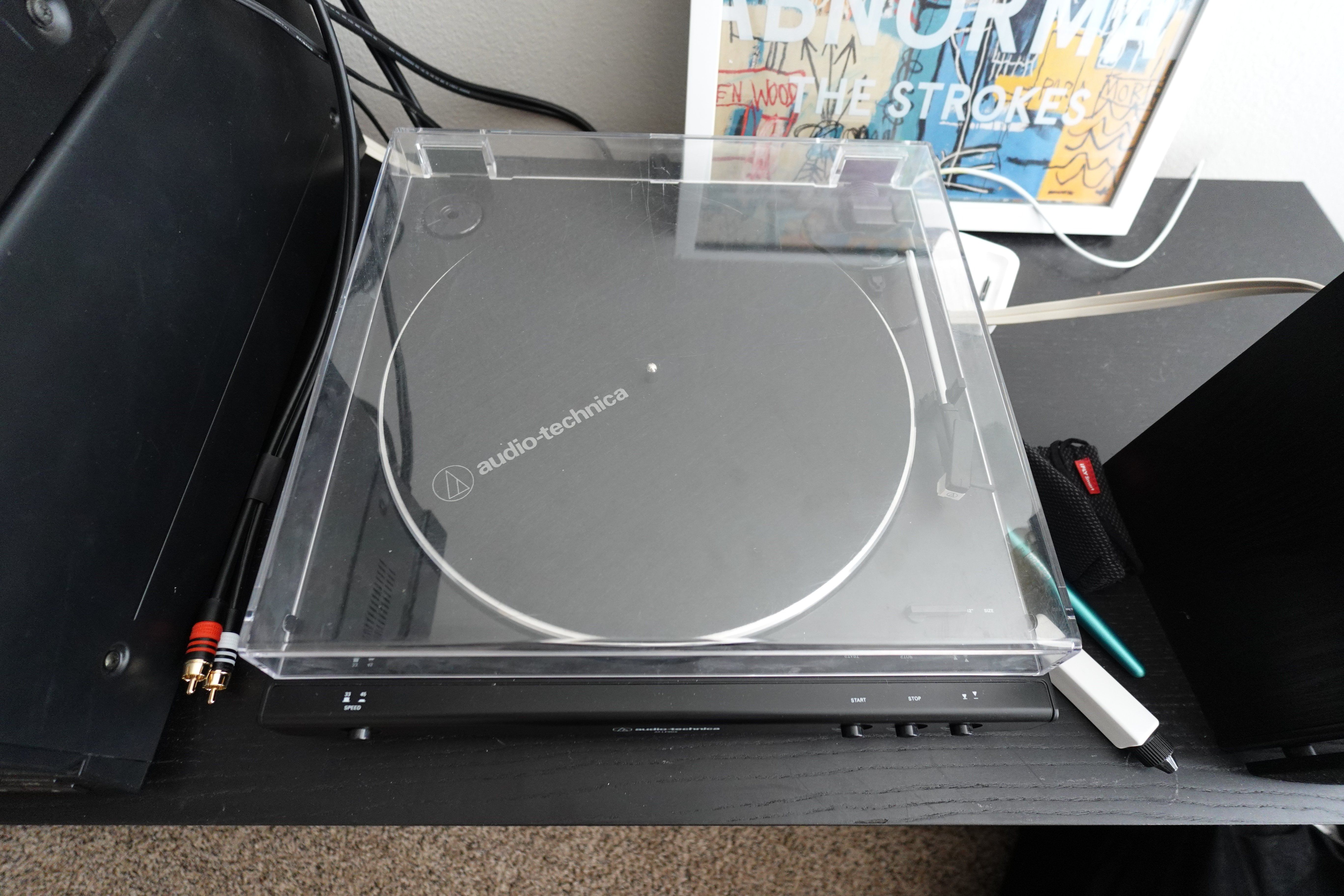 My Audio Technica AT-LP60X as seen from the top. No record in it, but you can see the bottom corner of the sleeve for my copy of The Strokes' "The New Abnormal" to the side.