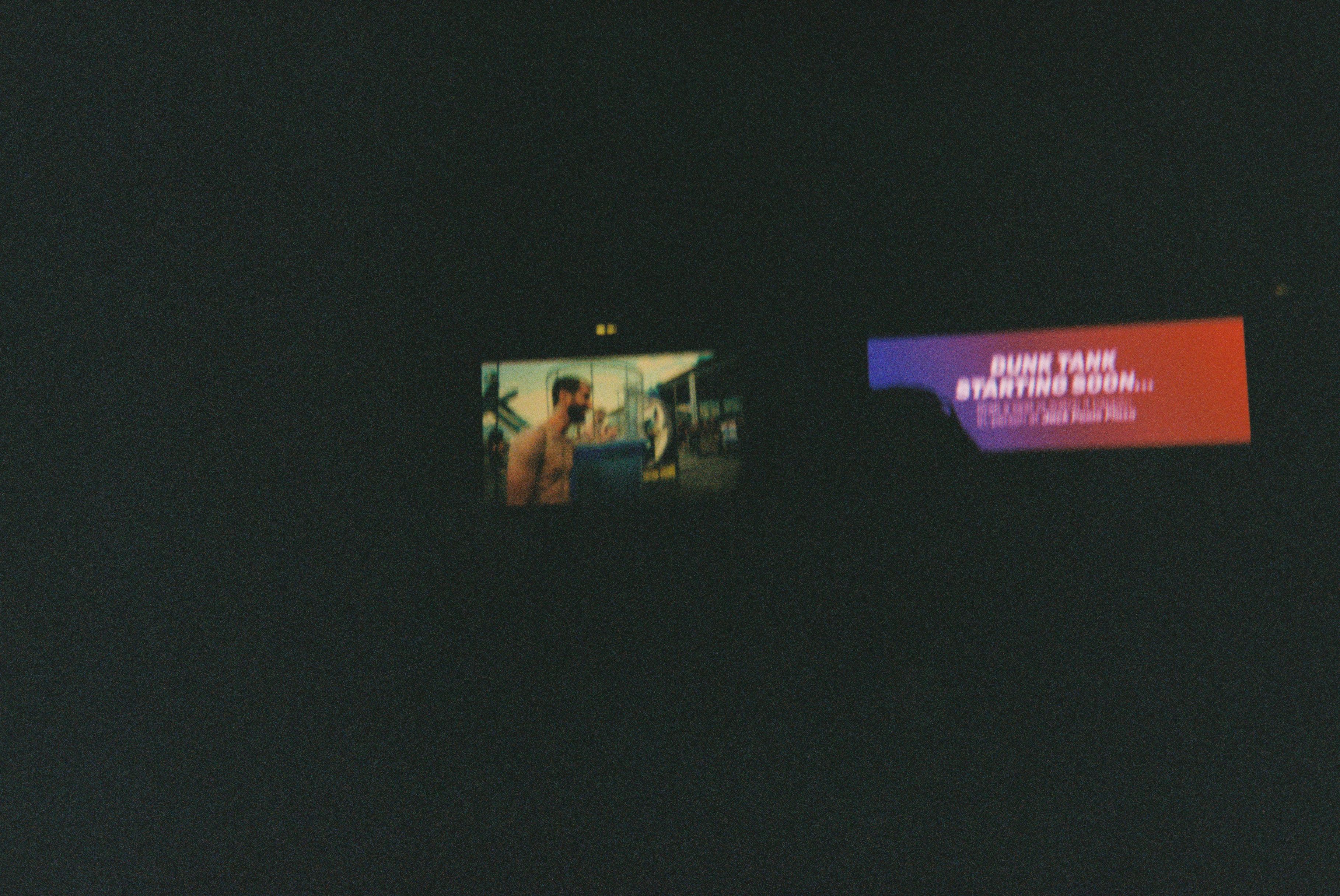 A very underexposed image of the stream of the dunk tank at the close of the convention