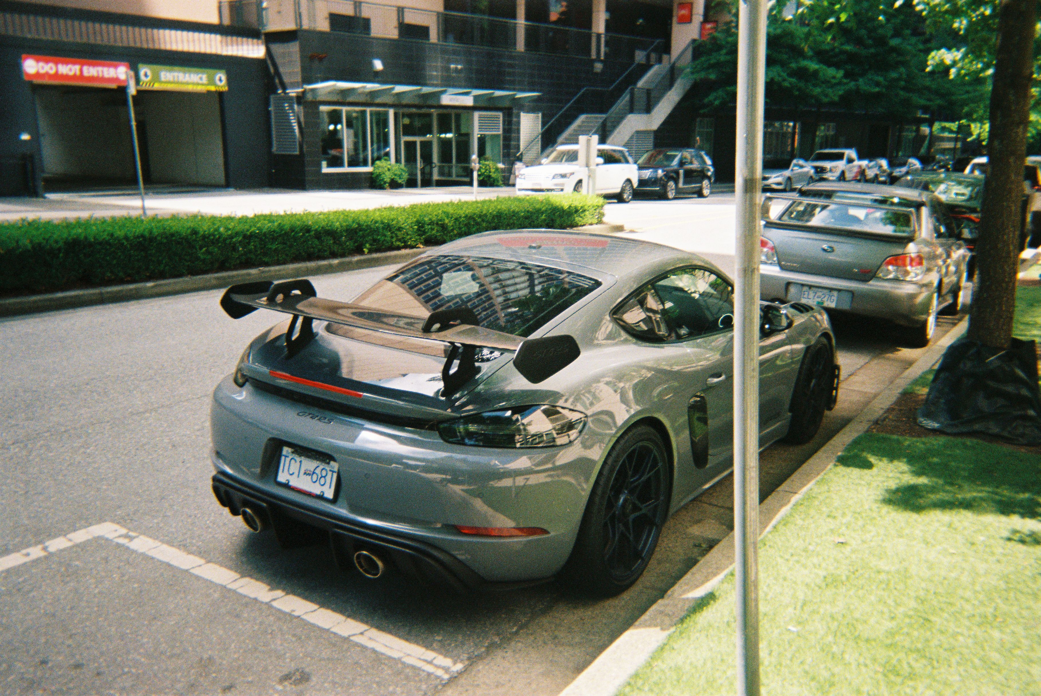 A 2023 Porsche 718 Cayman GT4 RS parked on the street in Vancouver, BC