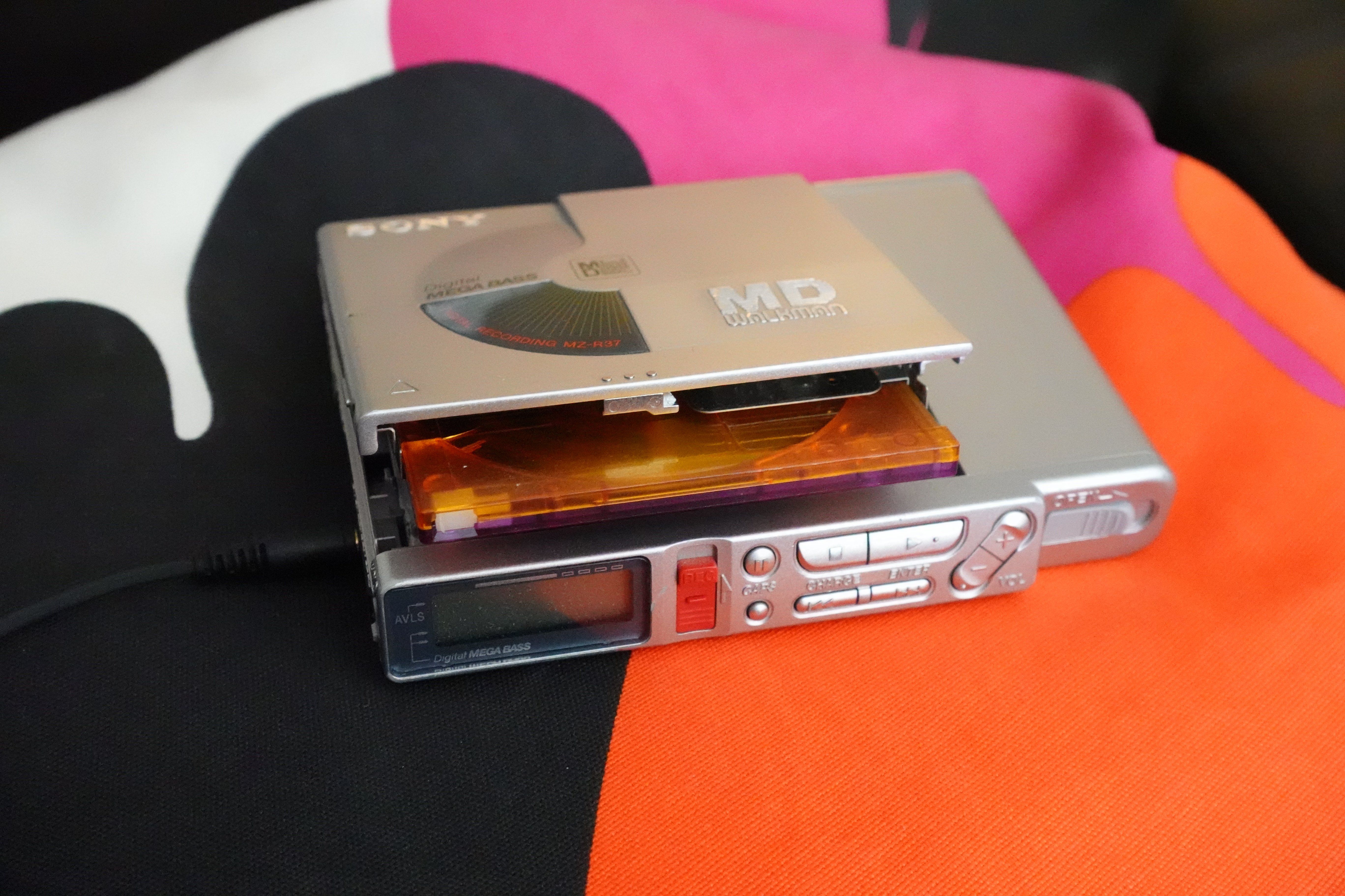 My Sony MZ-R37 as seen from the front, with the disc compartment open and a disc peeking out