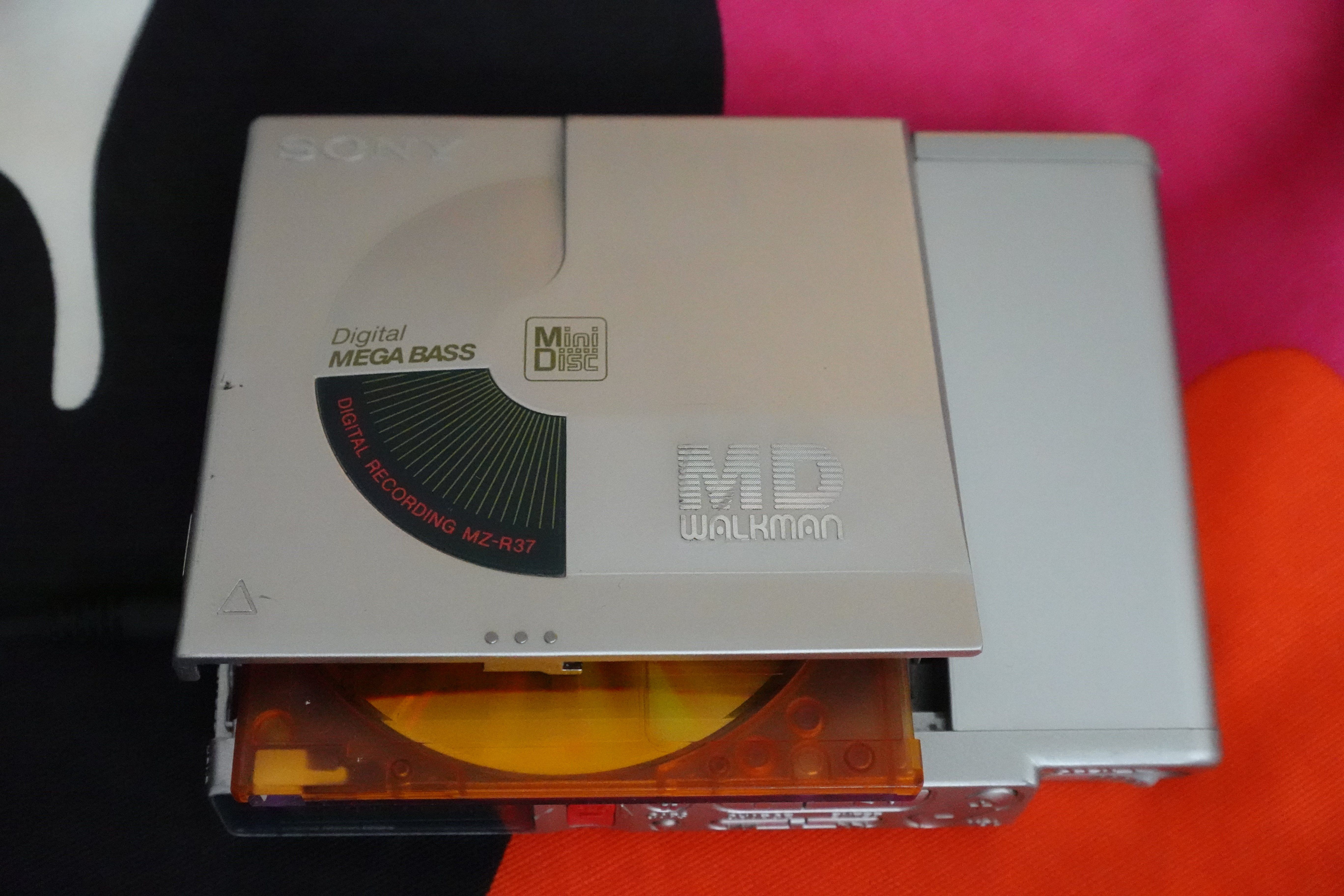 My Sony MZ-R37 as seen from the top, with the disc compartment open and a disc peeking out
